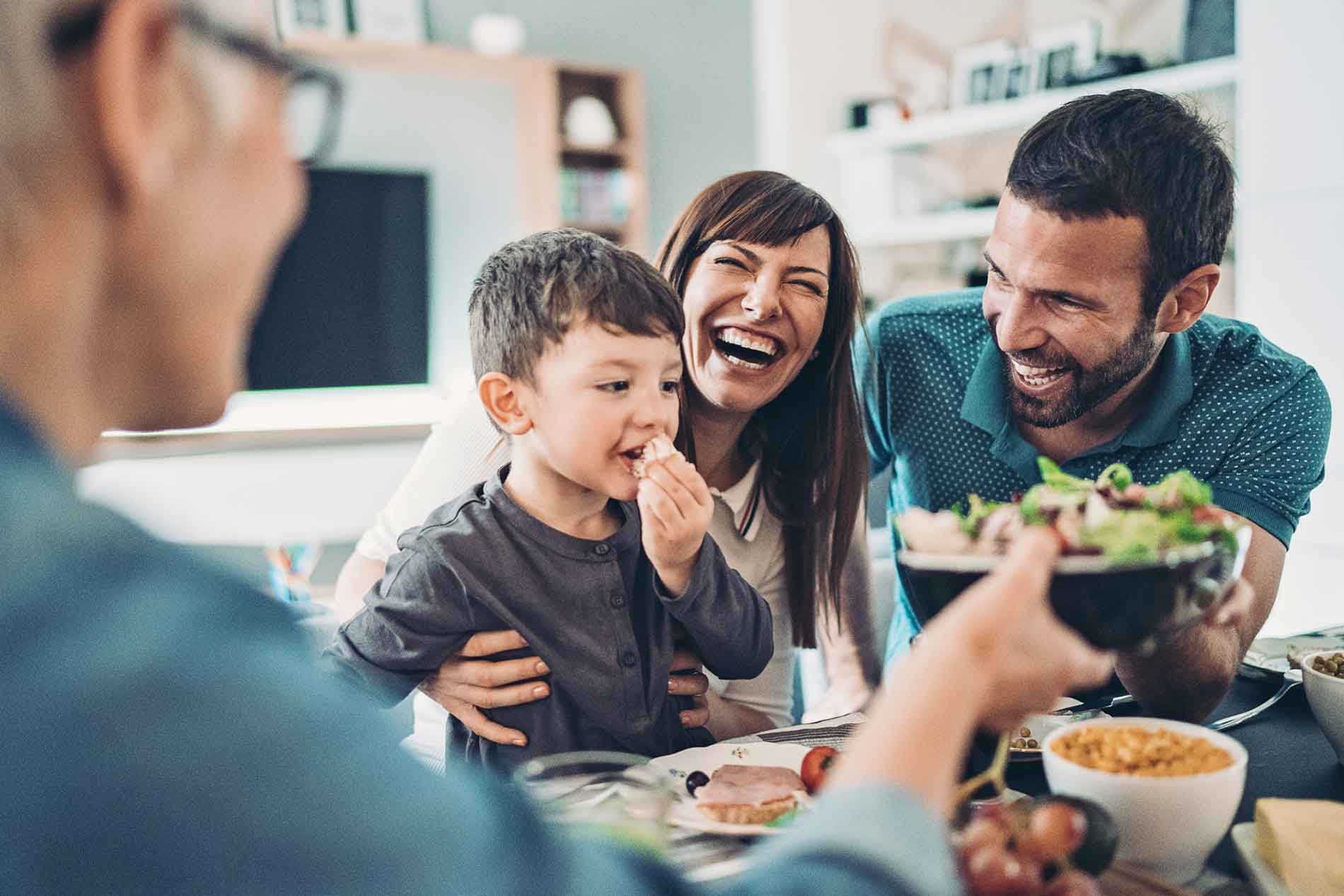 Grandmother, Mother, Father, and a boy having lunch