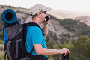 Man with hearing aids hiking.